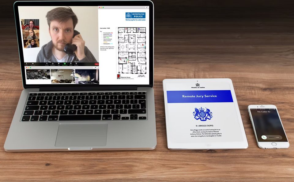 Jury Duty online: a live defendant on a laptop alongside digital evidence.